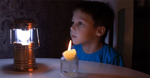 Boy with candle and lamp